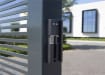 Grey finish Locinox Modulec-SA Surface Mounted Electric Strike installed on a gate
