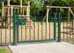 Green vertical railing gate installed around park 