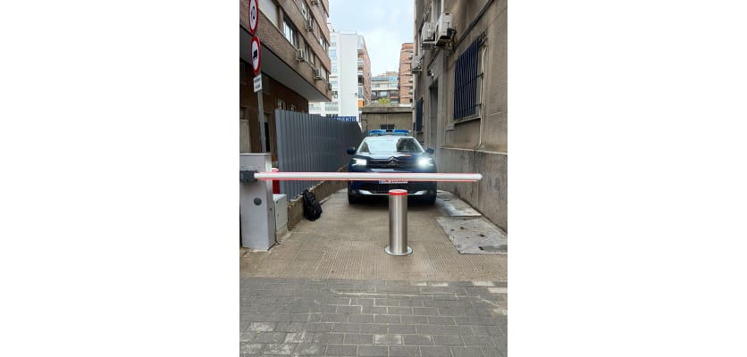 Benito H2208H75L bollard installed with an automatic arm barrier for vehical access