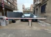 Benito H2208H75L bollard installed with an automatic arm barrier for vehical access