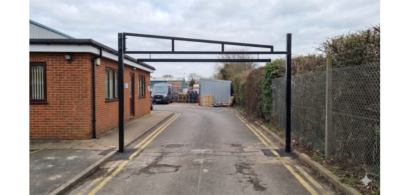 Black Swing Height Restrictor Barrier installed in a private car park