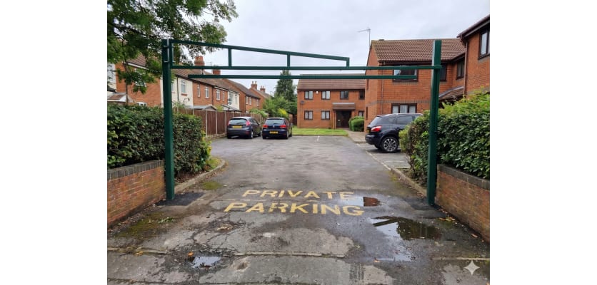 Green Swing Height Restrictor Barrier installed in a private car park