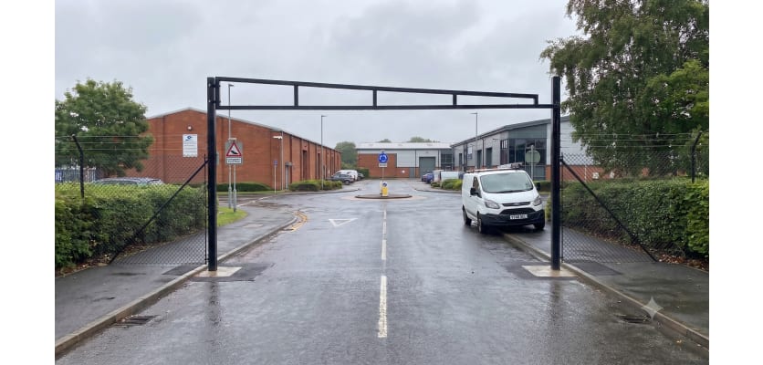 Black Swing Height Restrictor Barrier installed at a private car park