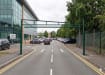 Green Swing Height Restrictor Barrier installed at a staff parking entrance