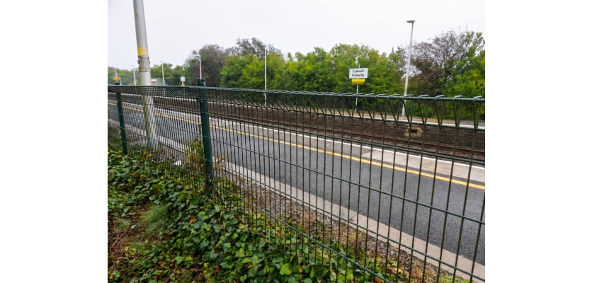 Green safe top mesh installed near railway tracks