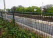 Green safe top mesh installed near railway tracks