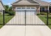 OldStead Welded Residential 3 Rail Flat Top Drive Gate installed in front of house