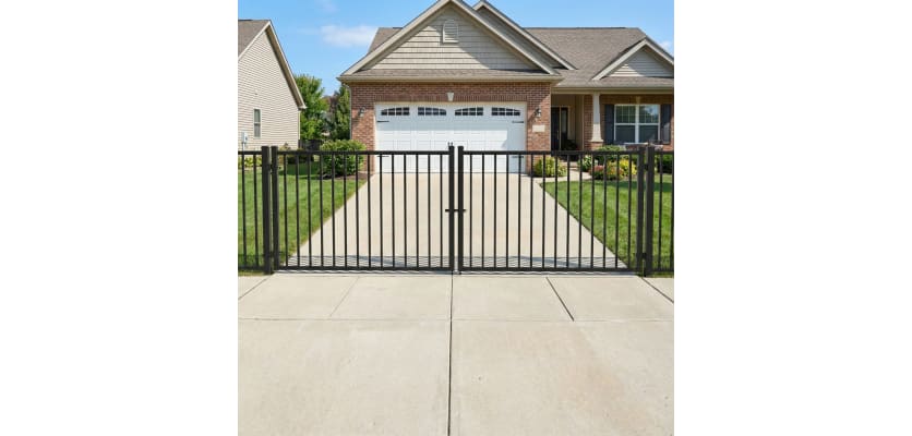 OldStead Welded Commercial 2 Rail Flat Top Drive Gate installed in front of property