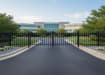 OldStead Rackable Commercial 3 Rail Spear Top Drive Gate installed outside commercial property