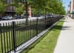 OldStead Rackable Commercial 46" 3 Rail Spear Top Fencing installed in parking lot