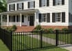 Aluminum Rackable Residential 3-Rail Flat Top Fence Panels installed outside a family home.