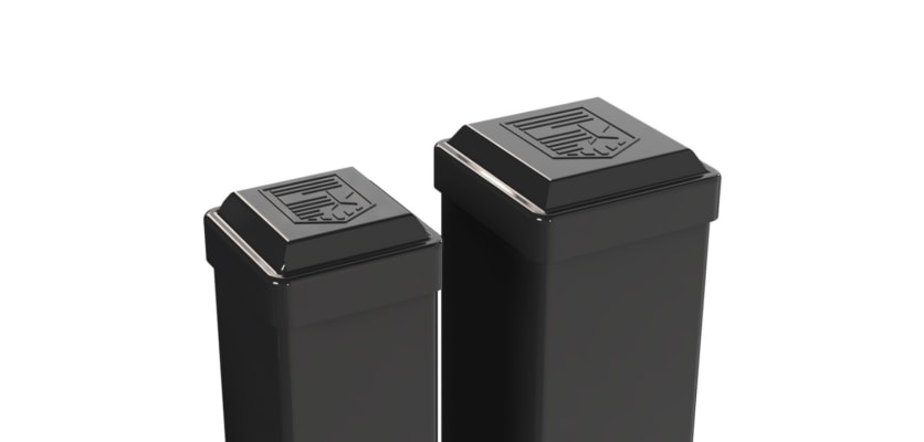A pair of black Aluminum Gate Posts featuring decorative pyramid caps with an embossed logo for a secure yard entrance.