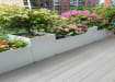 Gray composite decking with potted plants on top