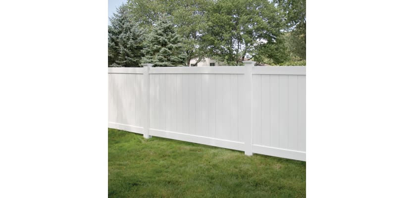 Vinyl privacy fencing installed in a garden
