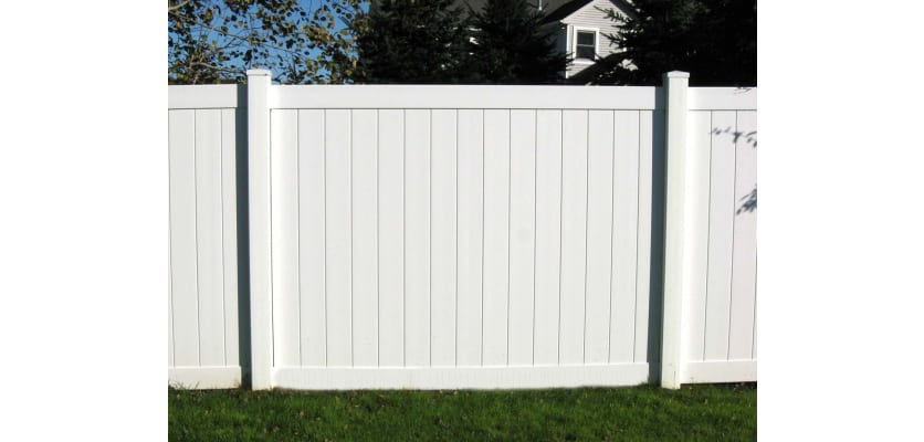 White vinyl fencing installed in a yard