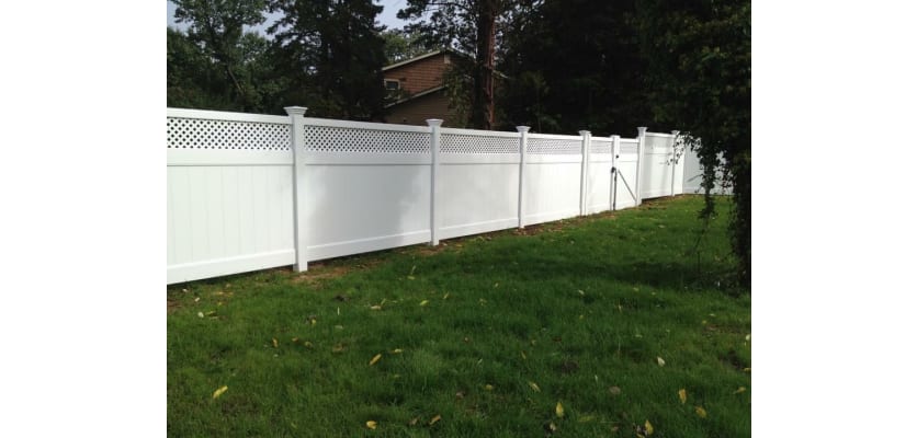 White vinyl fencing installed around a yard property line