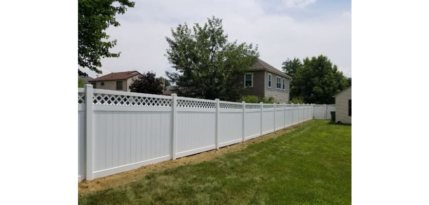 White vinyl fencing installed around a yard