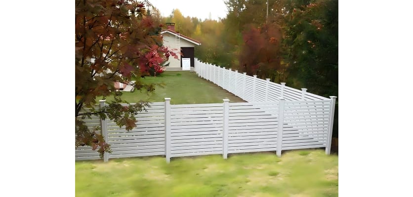 White vinyl fencing installed around a yard