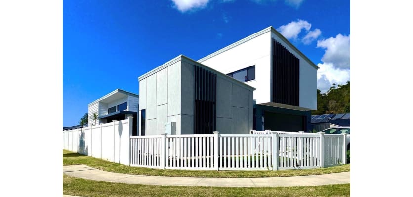 Vinyl fencing installed around a modern home