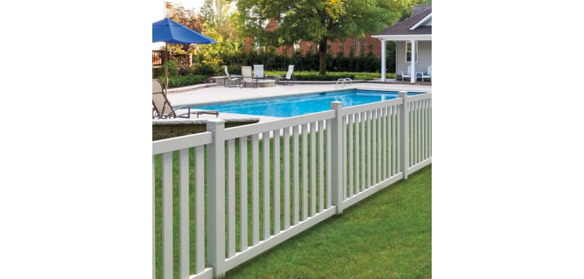 Vinyl fencing installed around a yard and a pool
