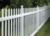 Vinyl Picket Fence installed around a property edge