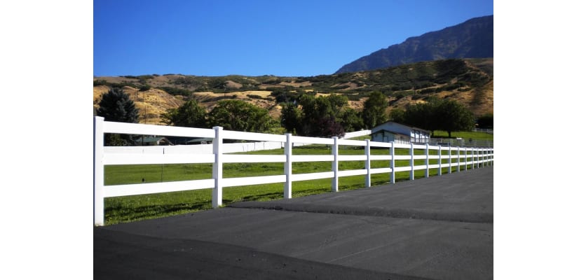 Vinyl 3 Rail Ranch Rail installed on the side of a private road