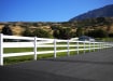 Vinyl 3 Rail Ranch Rail installed on the side of a private road