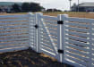 NewStead Vinyl Closed Picket Walk Gate in a fencing perimeter