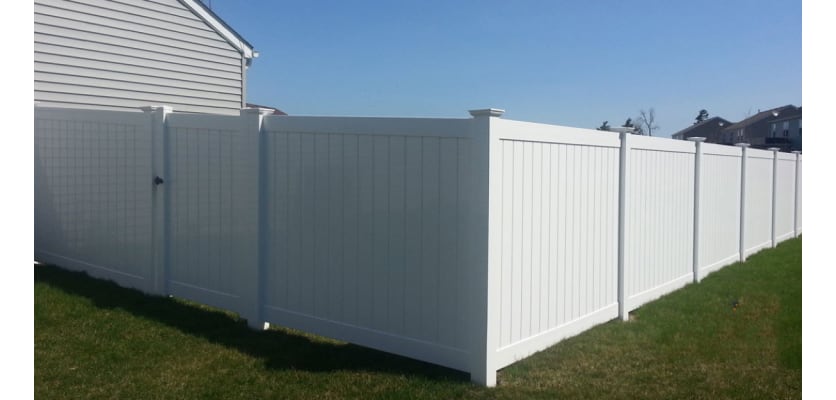 White vinyl fencing installed around a yard
