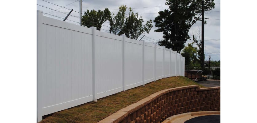 White vinyl fencing with a mesh topper to add security
