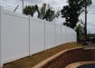White vinyl fencing with a mesh topper to add security