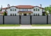 Gray Aluminum Walk Gate and fencing installed outside house
