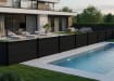 Black plastic fencing installed next to pool