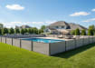 A Perimeter of Light Grey NewStead Wood Plastic Composite Fencing around a Pool 