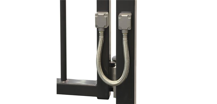 A Locinox DVK-HD-450 Reinforced Braided Stainless Steel Safety Cable attached to a Gate