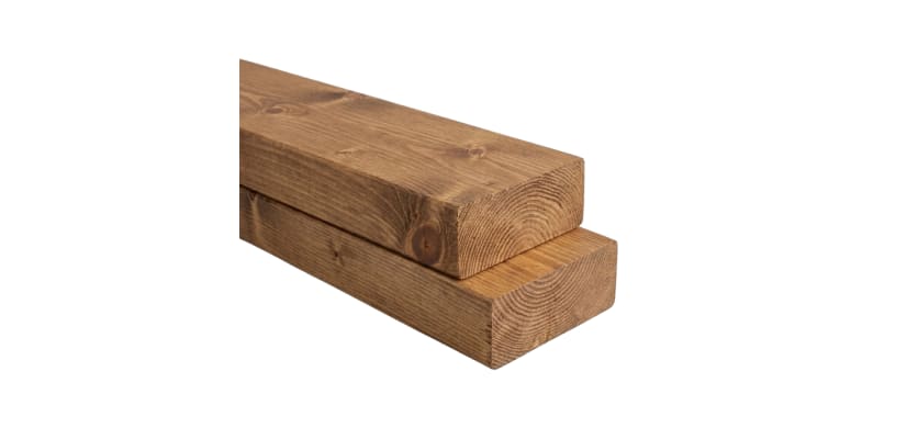 Medium brown stained dimensional lumber boards stacked – timber beams for fencing rails, framing and outdoor construction