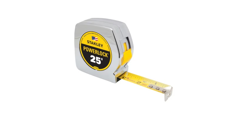 Angled Stanley Powerlock 25-foot tape measure with the yellow blade partially extended.