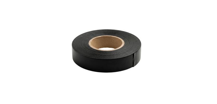 A roll of black three-quarter-inch electrical tape lying flat on a white background.